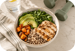 A protein bowl with chicken, quinoa, sweet potato and avocado